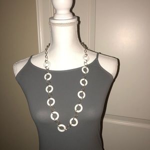 The Limited silver hook with white hoop necklace.
